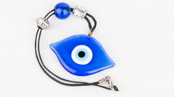 A broken evil eye amulet, symbolizing deflected negativity.