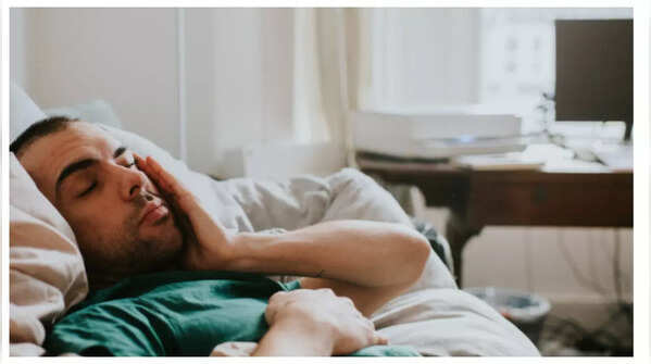 Frustrated man feeling the urge to urinate despite empty bladder.