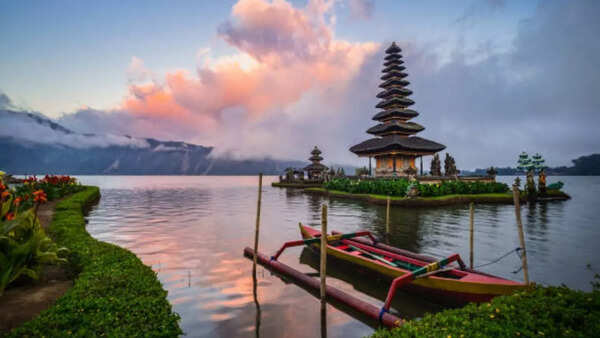 Tranquil beach scene in Bali with traditional Balinese boats