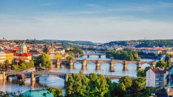 Iconic Charles Bridge and Prague Castle at sunset