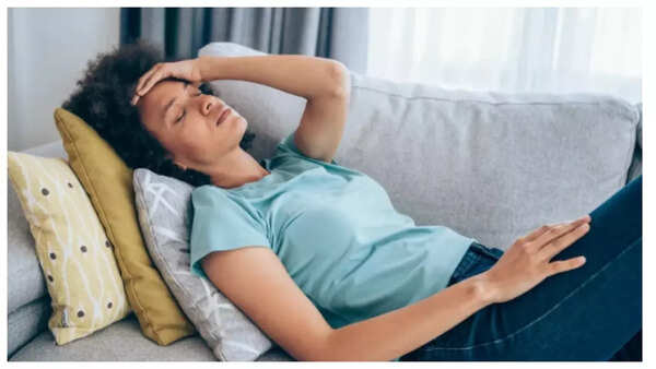 Stressed woman with hands on her head