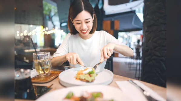Woman smiling, showing off healthy and glowing skin