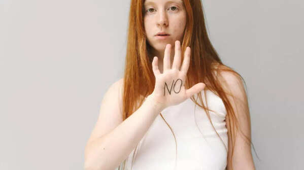 Person confidently setting a boundary.