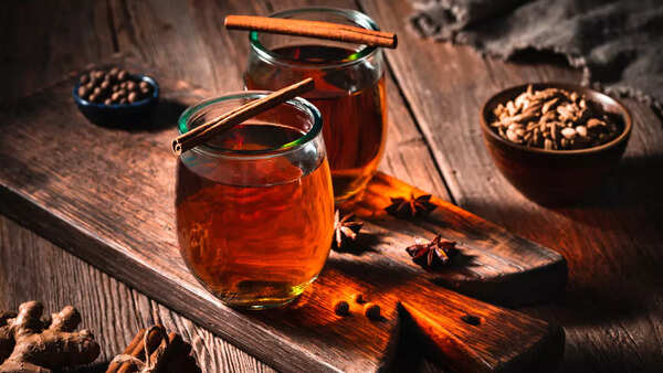 Warm cinnamon tea with a cinnamon stick garnish
